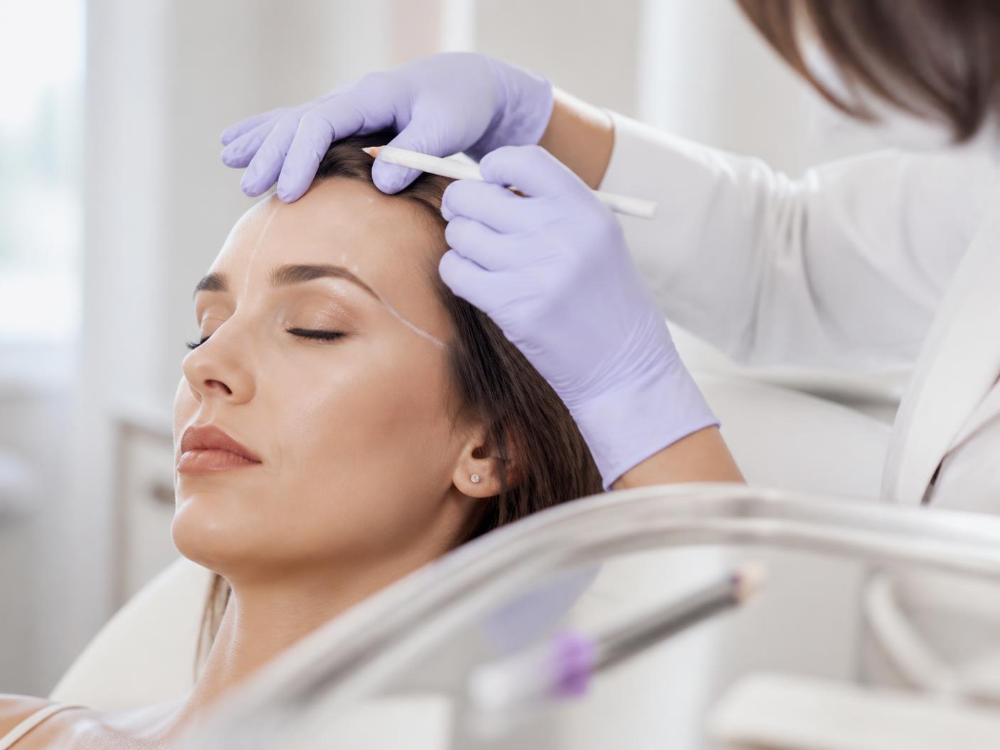 Physician performing a precise injectable treatment